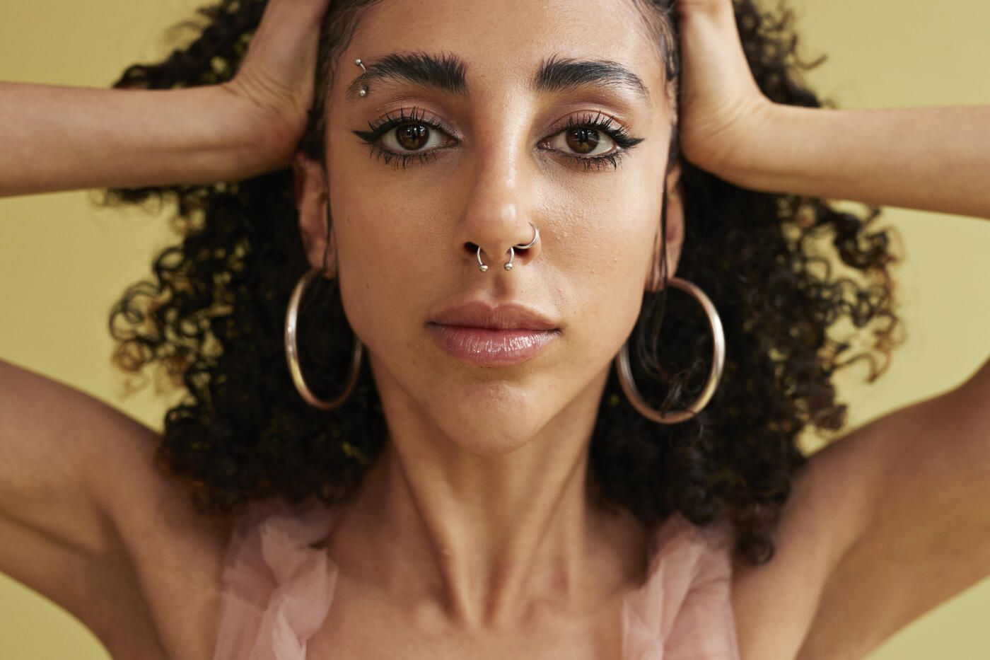 Close-up portrait of frustrated non-binary person