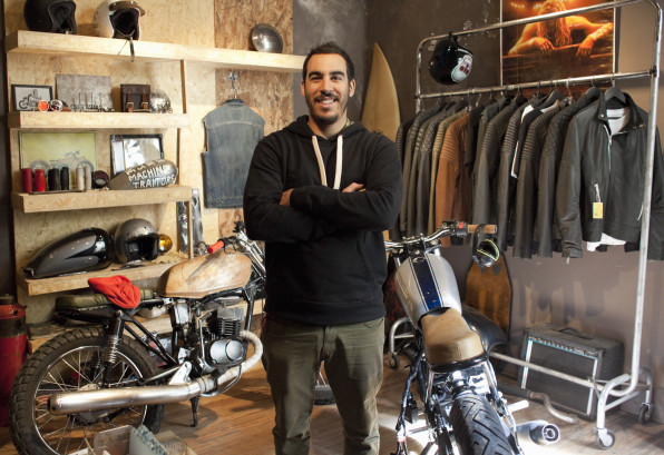 motorcycle shop owner in his showroom