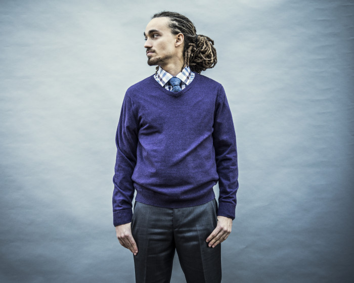 Portrait of young businessman with dreadlocks