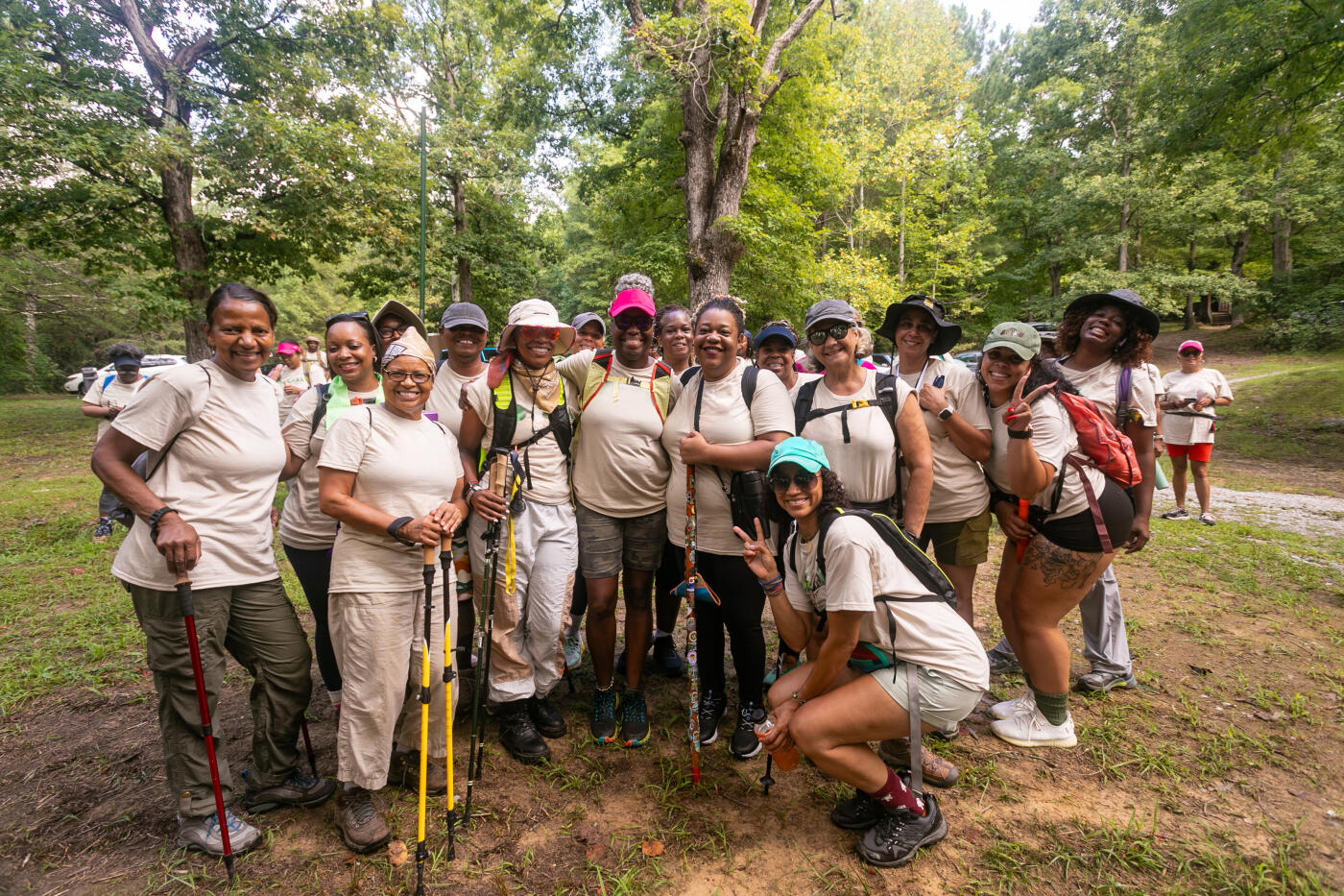 large group of women hikers out in the campground ready to hike