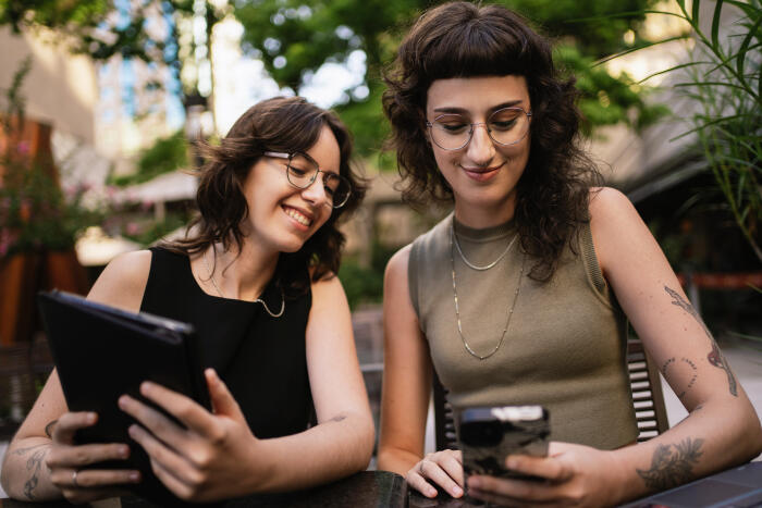 Lesbian couple talking about their investments