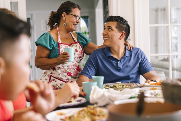 Three generations having dinner together