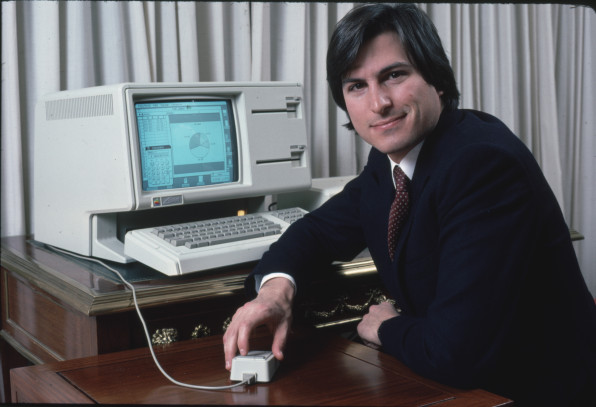 Apple computer Chrmn. Steve Jobs w. new LISA computer during press preview.