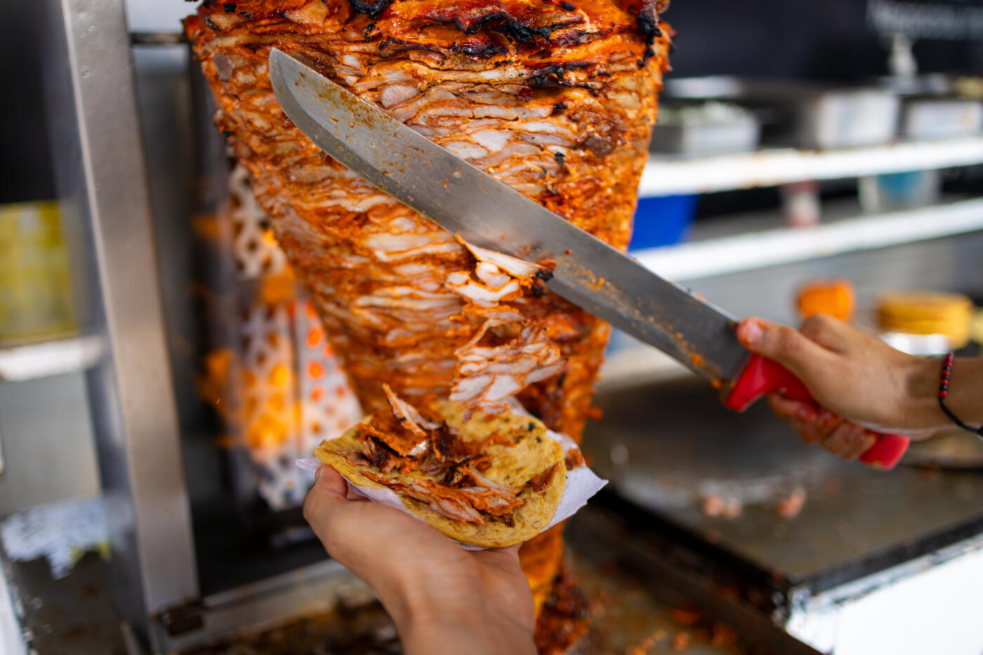 Detail of the cut of the trompo of the al pastor meat for tacos.