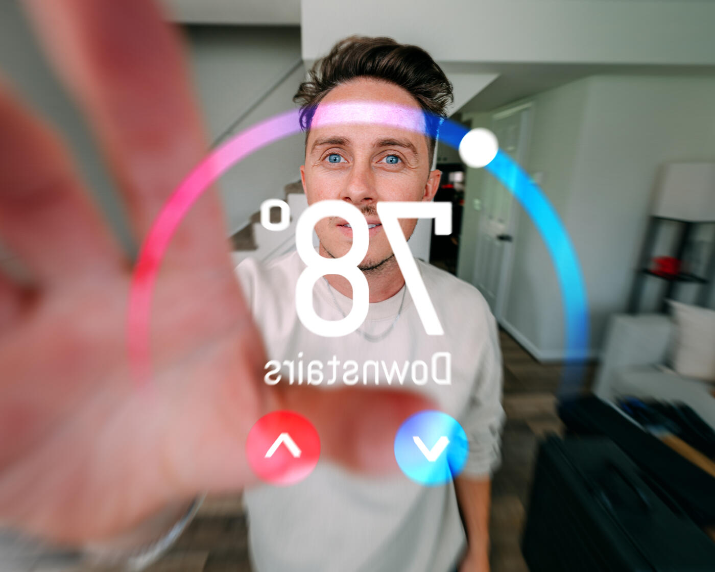 Cheerful, Handsome Young Man Adjusting a Smart Digital Thermostat, from Unique Perspective of the Home Automation Thermostat Screen
