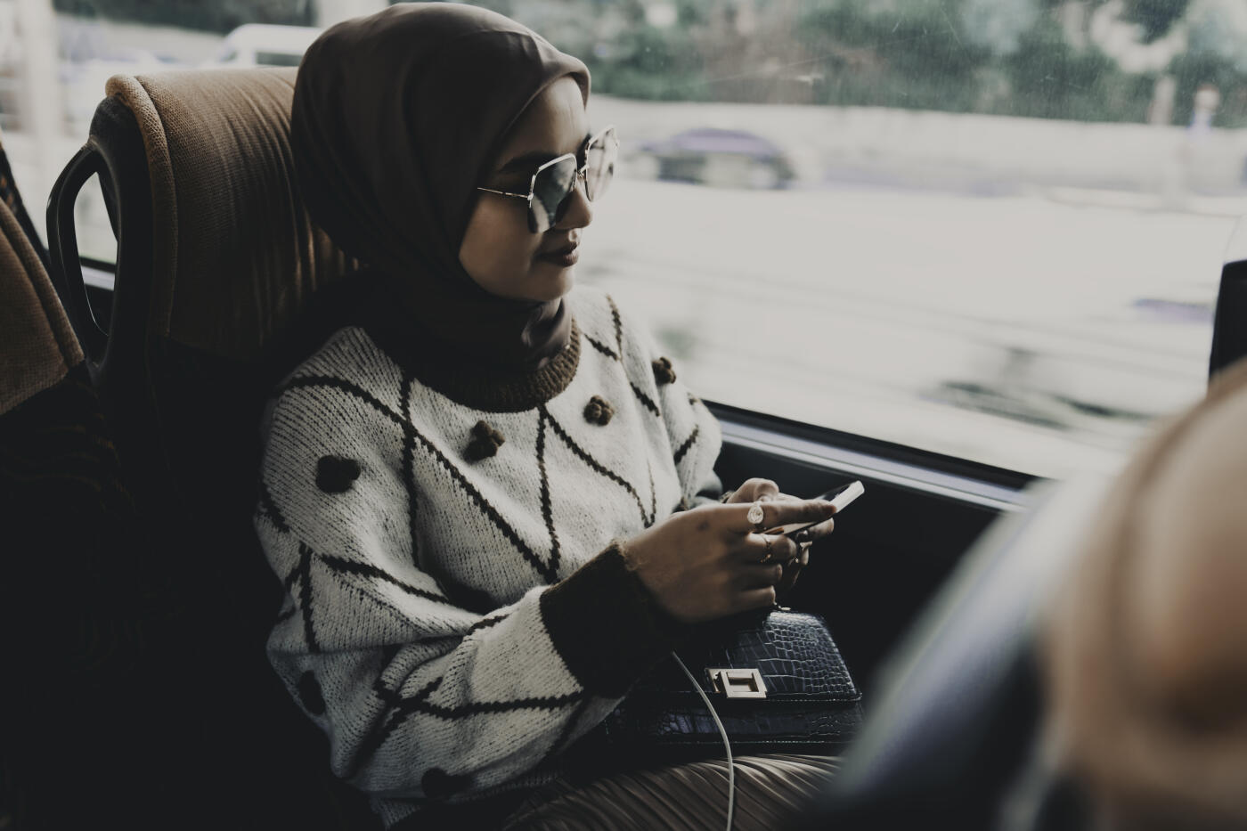 Woman inside a bus  on the phone