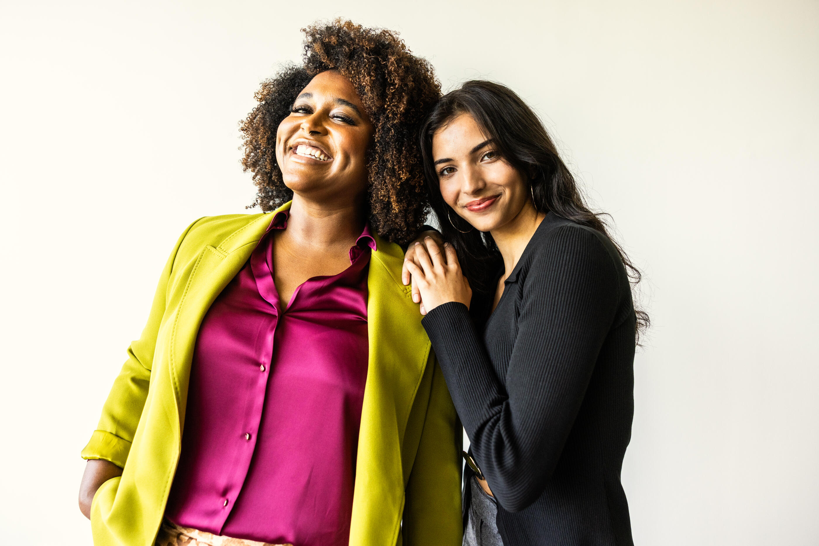 Portrait of beautiful and fashionable young women on white background