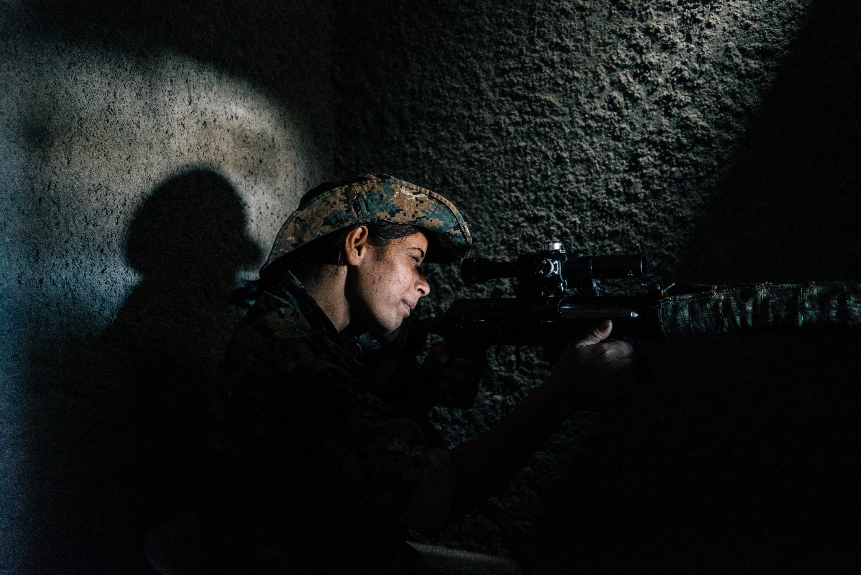 RAQQA, SYRIA, JUNE 22: A YPJ sniper watches ISIS positions in east Raqqa city. (Photo Alice Martins for The Washington Post via Getty Images)