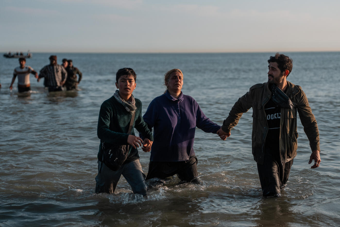 GRAVELINES, FRANCE - JUNE 17: A visually impaired woman is helped back to shore after missing a space in a migrant dinghy on June 17, 2025 in Gravelines, France. A record number of migrants have made the illegal crossing from France to the UK via small boats so far this year. Figures surpassed the 16,000 mark last week, which is 42% more than the same point last year. The UK government has vowed to crackdown on people smugglers and illegal migration, with Chancellor Rachel Reeves announcing as part of the government's spending review that the Border Security Command would be funded up to £280m more per year by the end of the review period in 2028-29. (Photo by Carl Court/Getty Images)