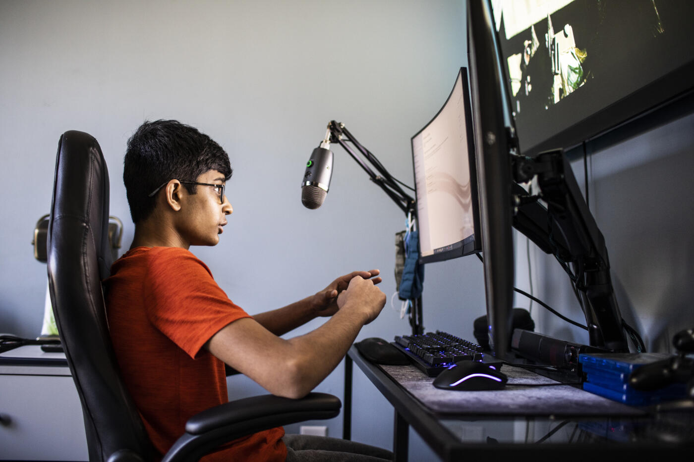 High school boy online gaming at home