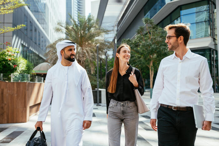 Business people in financial district walking and discussing finances