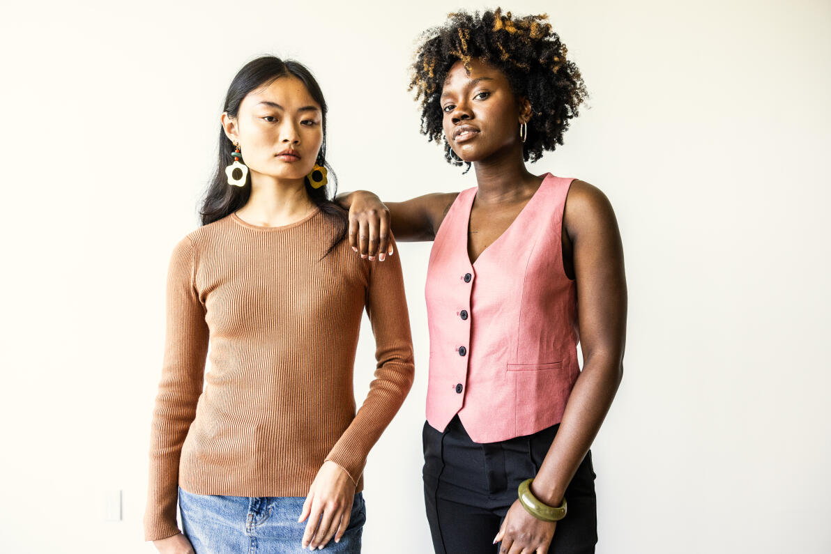 Portrait of beautiful and fashionable young women on white background