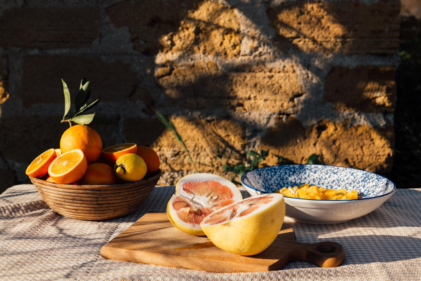 Couple visiting Sicily, sightseeing, visiting orange harvesting warehouse, picking oranges with locals, making and drinking juice, visiting old town. Part of a series with video