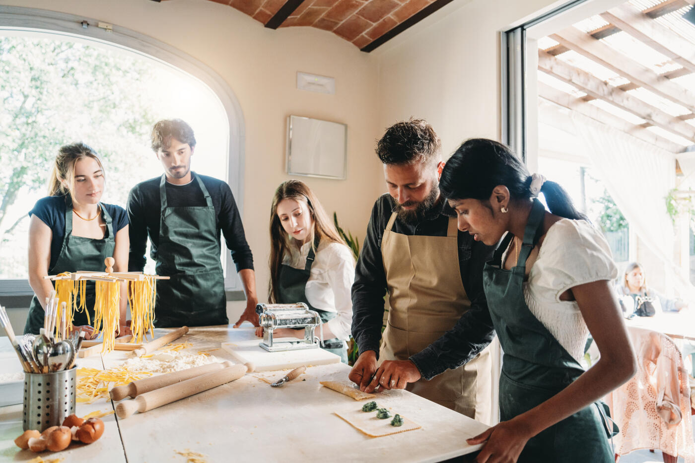 A chef is preparing ravioli during a cooking class. Ricotta and spinach ravioli.