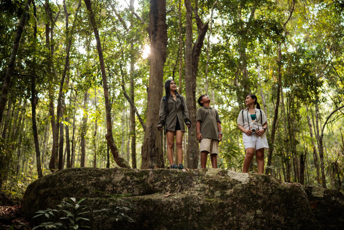 Mother and children exploring a nacional park in Thailand