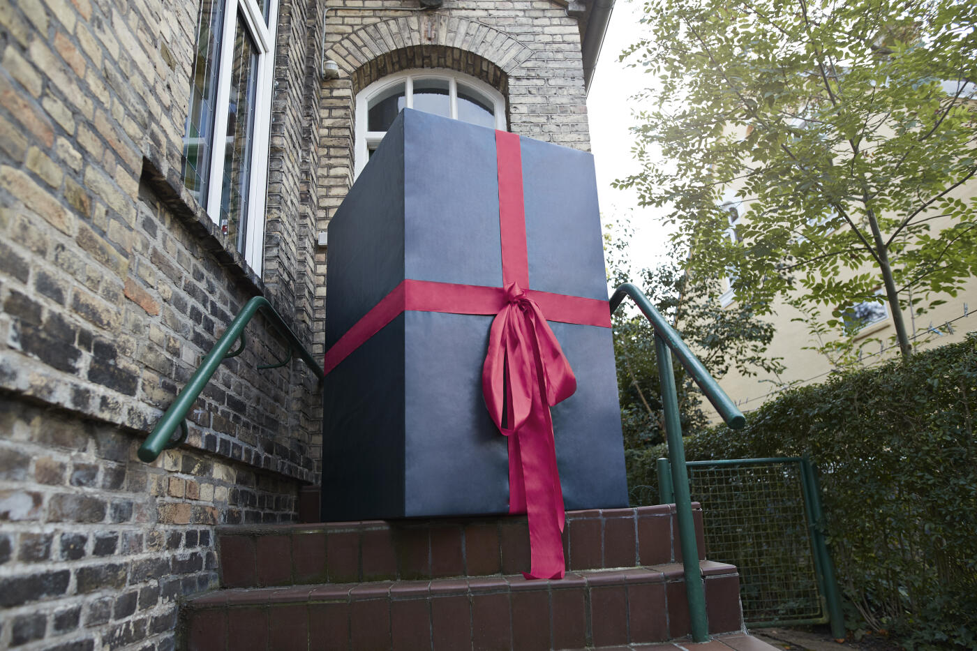 Large gift at entrance of house