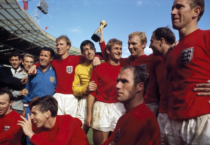 The victorious England team celebrate with the Jules Rimet Trophy after the FIFA World Cup Final between England and West Germany at Wembley Stadium in London, 30th July 1966.