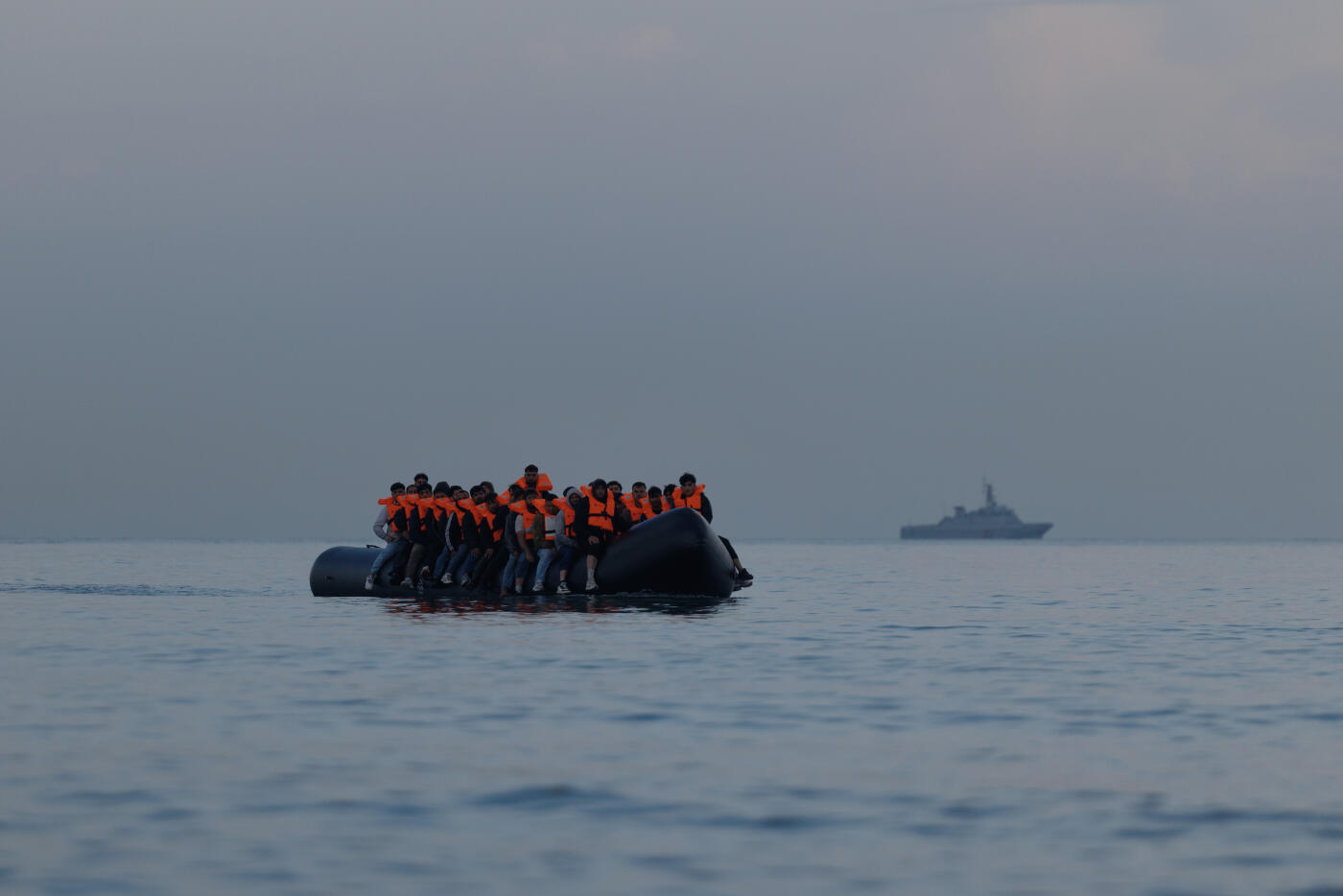 GRAVELINES, FRANCE - AUGUST 12: A small boat arrives to collect more migrant families from the beach on August 12, 2025 in Gravelines, France. More than 50,000 small boat migrants have now crossed the English Channel since Labour came to power last July. Last week the UK and France began implementing the so-called 'one-in, one-out' treaty, which was agreed during French President Emmanuel Macron's state visit last month, in an effort to curb illegal migration across the English Channel. Under the pilot scheme, a proportion of undocumented people arriving to the UK in small boats will be returned to France, in exchange for the same number of legitimate asylum seekers who may have family ties in the UK.  (Photo by Dan Kitwood/Getty Images)