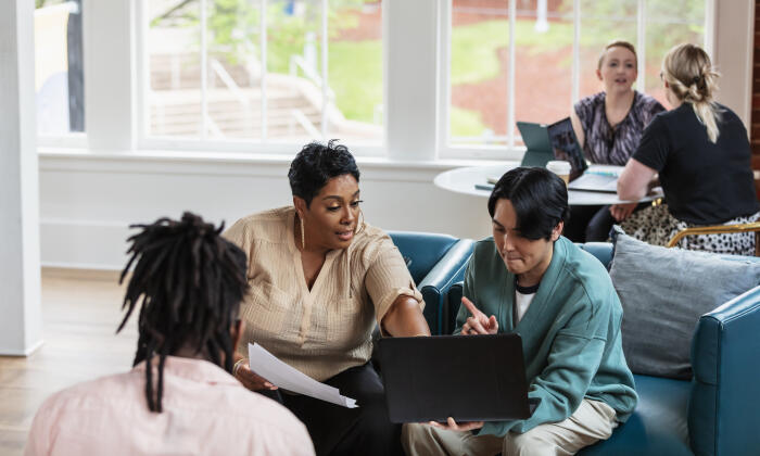 Business people working in shared office space