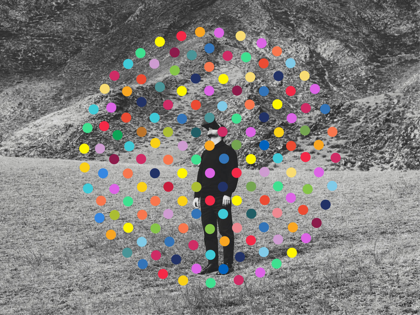 Man with virtual reality headset against nature background with colorful dots