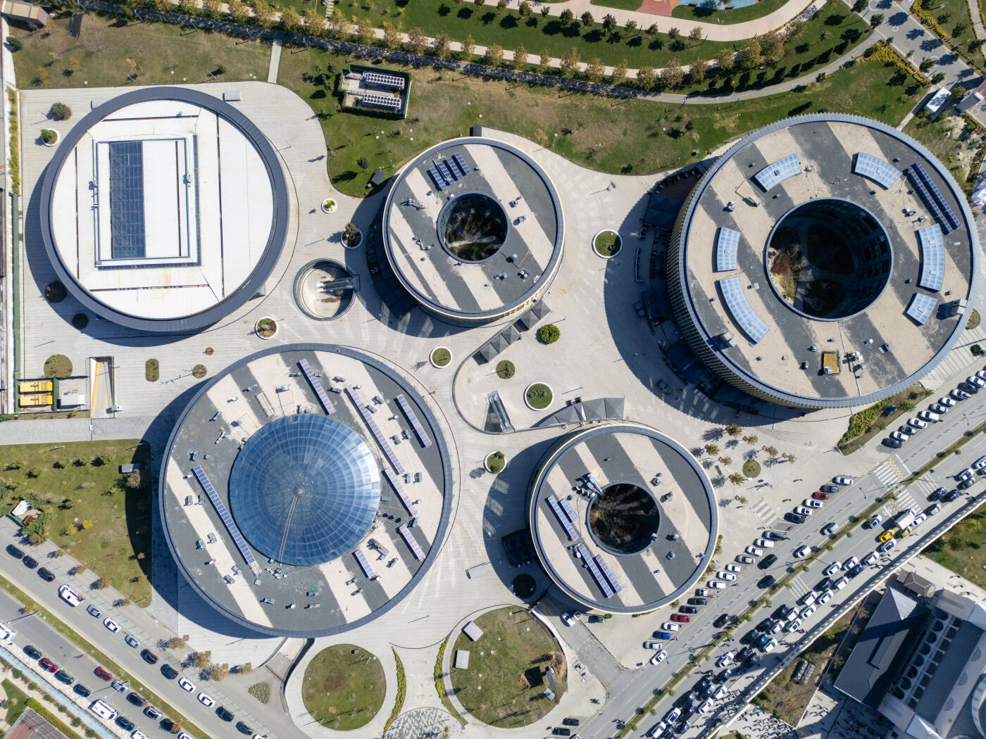 Aerial view of solar panels on a rooftop of a residential buildings. KUZEY YAKASI, It brings the largest park of the region to Basaksehir. It is an office project developed by Emlak Konut GYO (TOKİ subsidiary) in Basaksehir district. The project, which consists of 10 blocks in total, includes a congress center, commercial blocks and office blocks. TOKİ is a public institution affiliated with the Ministry of Environment, Urbanization and Climate Change of the Republic of Turkey, established specifically for the purpose of social housing production.