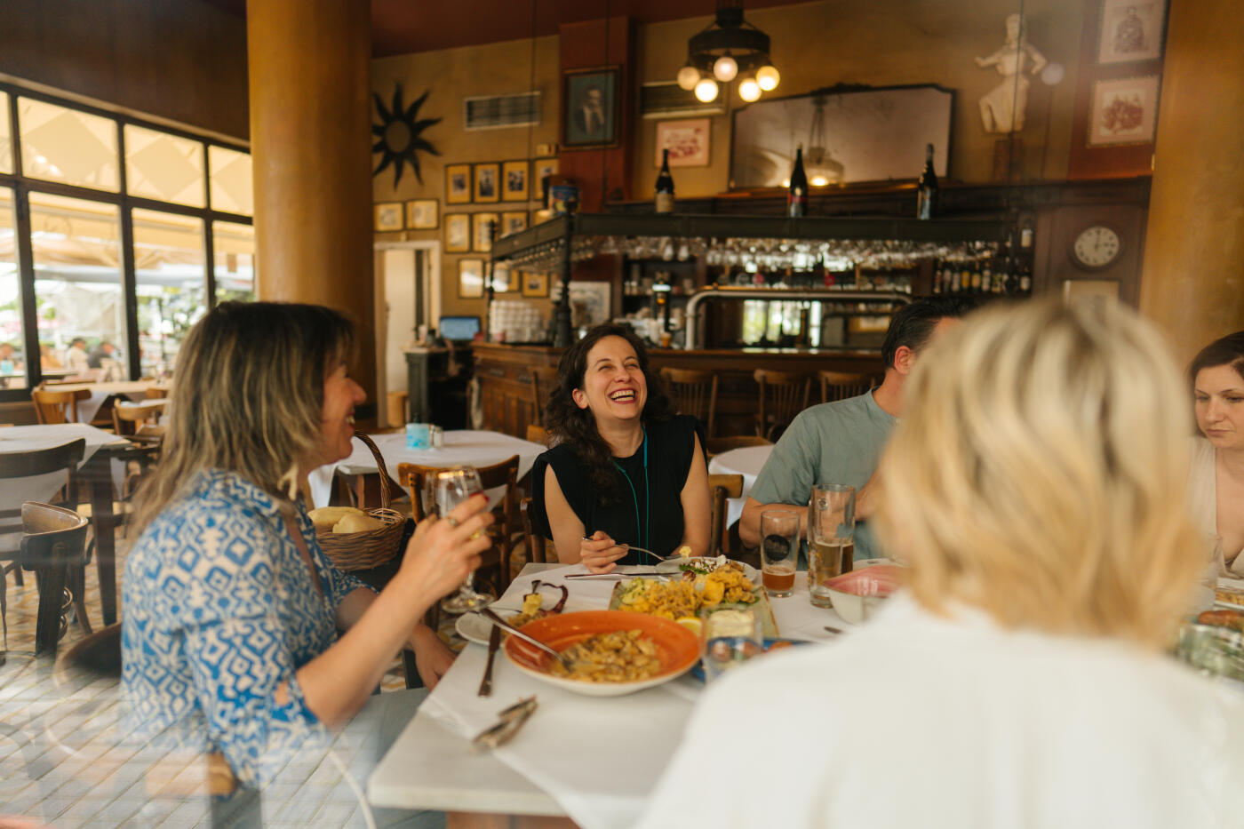Photo of a group of friends who enjoy brunch together and each other's company