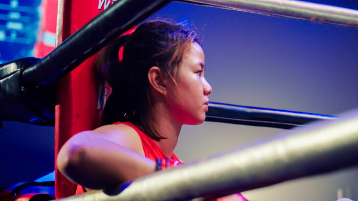 Boxer in red corner preparing before fight