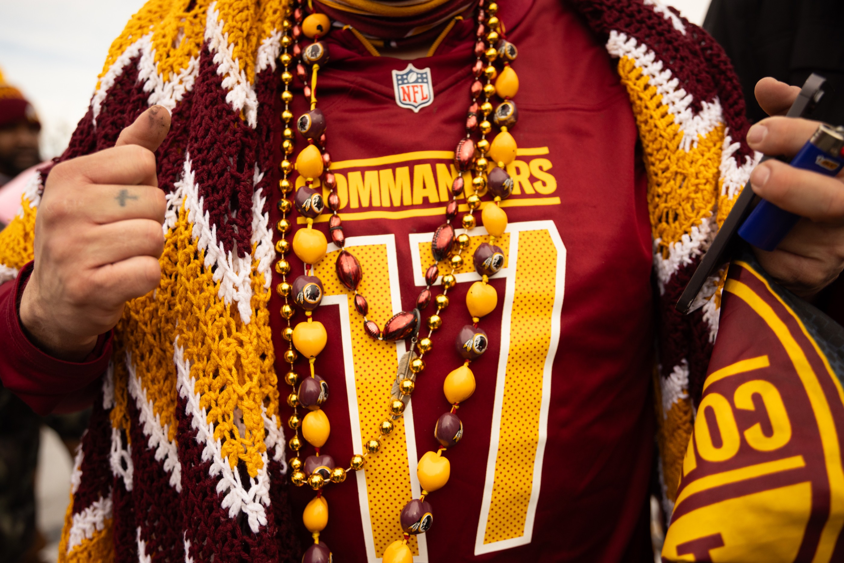 Washington Commanders fans wear team merchandise during a tailgate by Lincoln Financial Field in Philadelphia, PA on January 26, 2025. The Commanders face the Eagles in Philadelphia today to decide who will progress to the Super Bowl, in a historic season for the Washington team.

Photo credit: Maansi Srivastava for the Washington Post