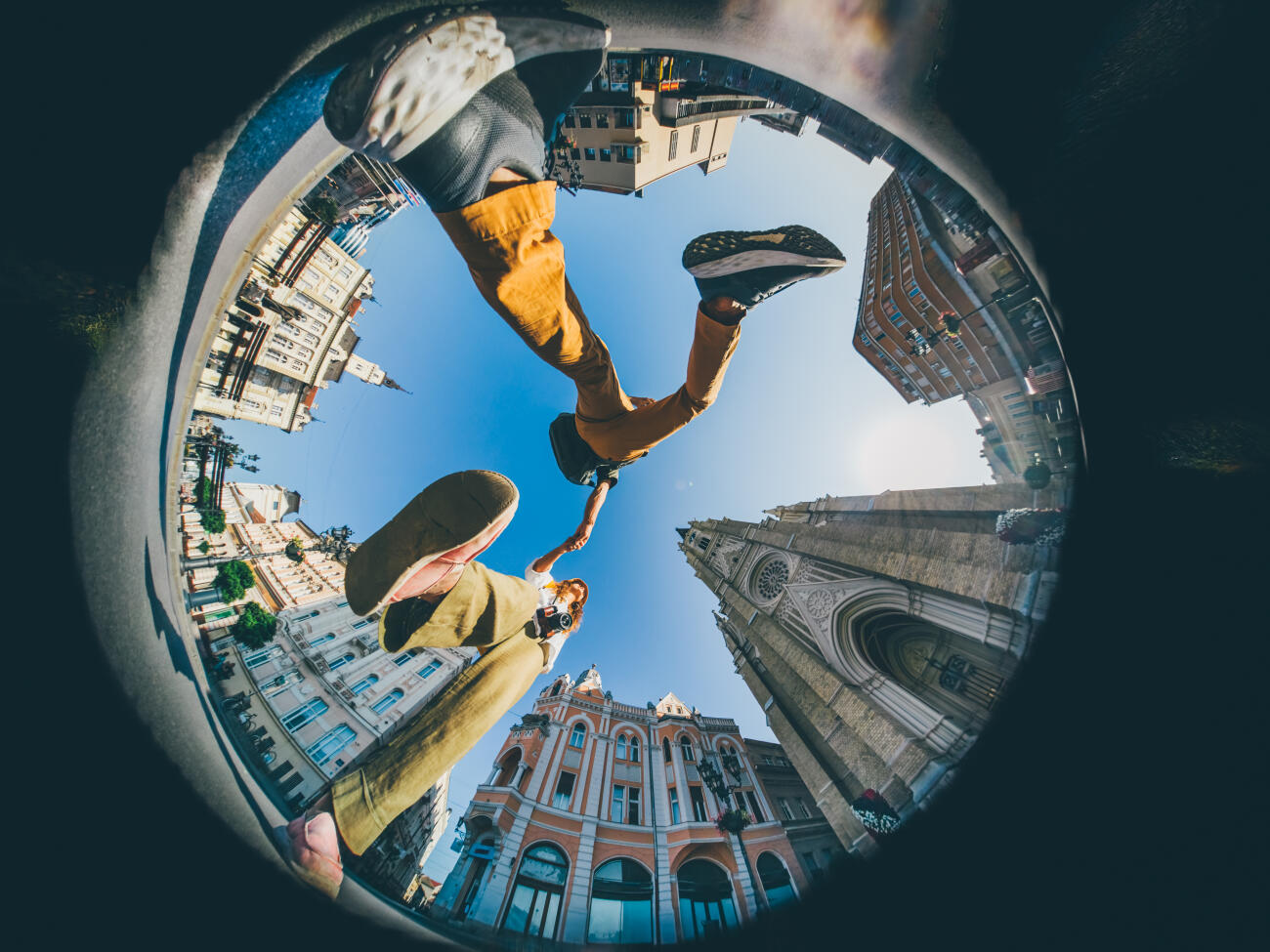 Happy traveler couple enjoying a famous place. Little Planet format.