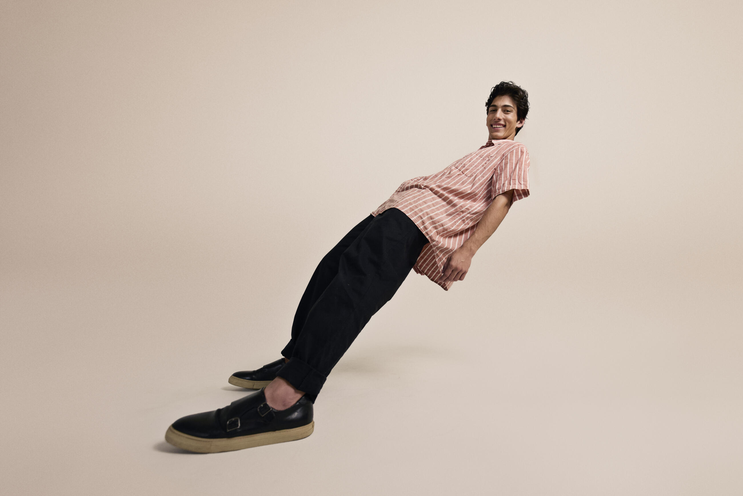 Smiling young man wearing striped shirt