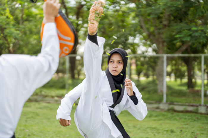 Two taekwondo athlete sparring practice