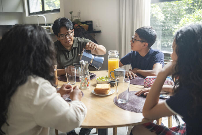 family enjoying breakfast together before the children go to school