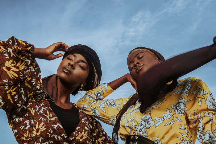 Two stylish Guyanese adult women posing together,Accra,Ghana