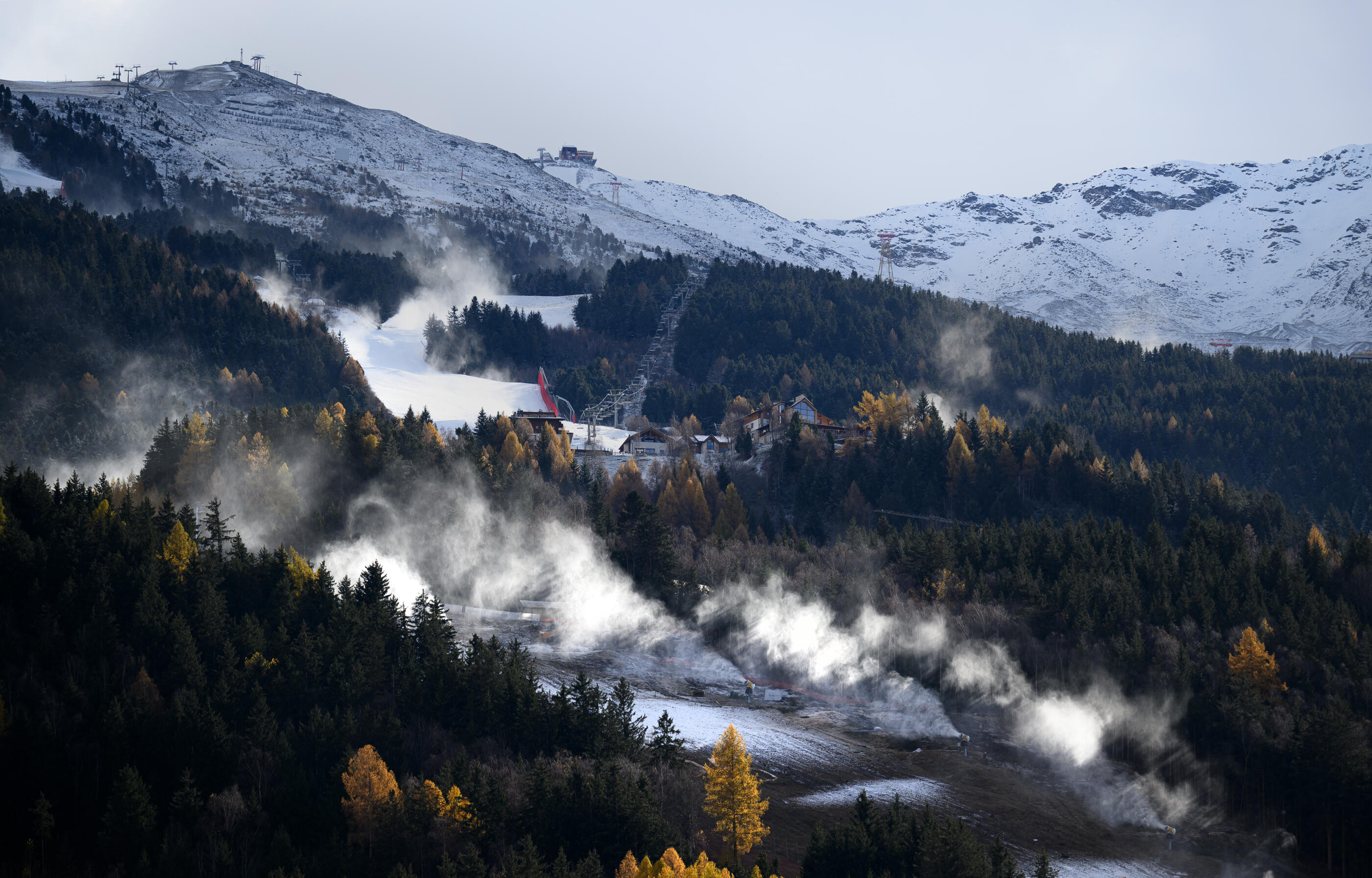 BORMIO, ITALY - NOVEMBER 20: Snowmaking machines produce first show on the Olympic slope for the men's alpine races of the The Milan Cortina 2026 Winter Olympics on November 20, 2024 in Bormio, Italy. The international multi-sport event is scheduled to take place from 6 to 22 February 2026 in the Italian cities of Milan and Cortina d'Ampezzo. (Photo by Matthias Hangst/Getty Images)