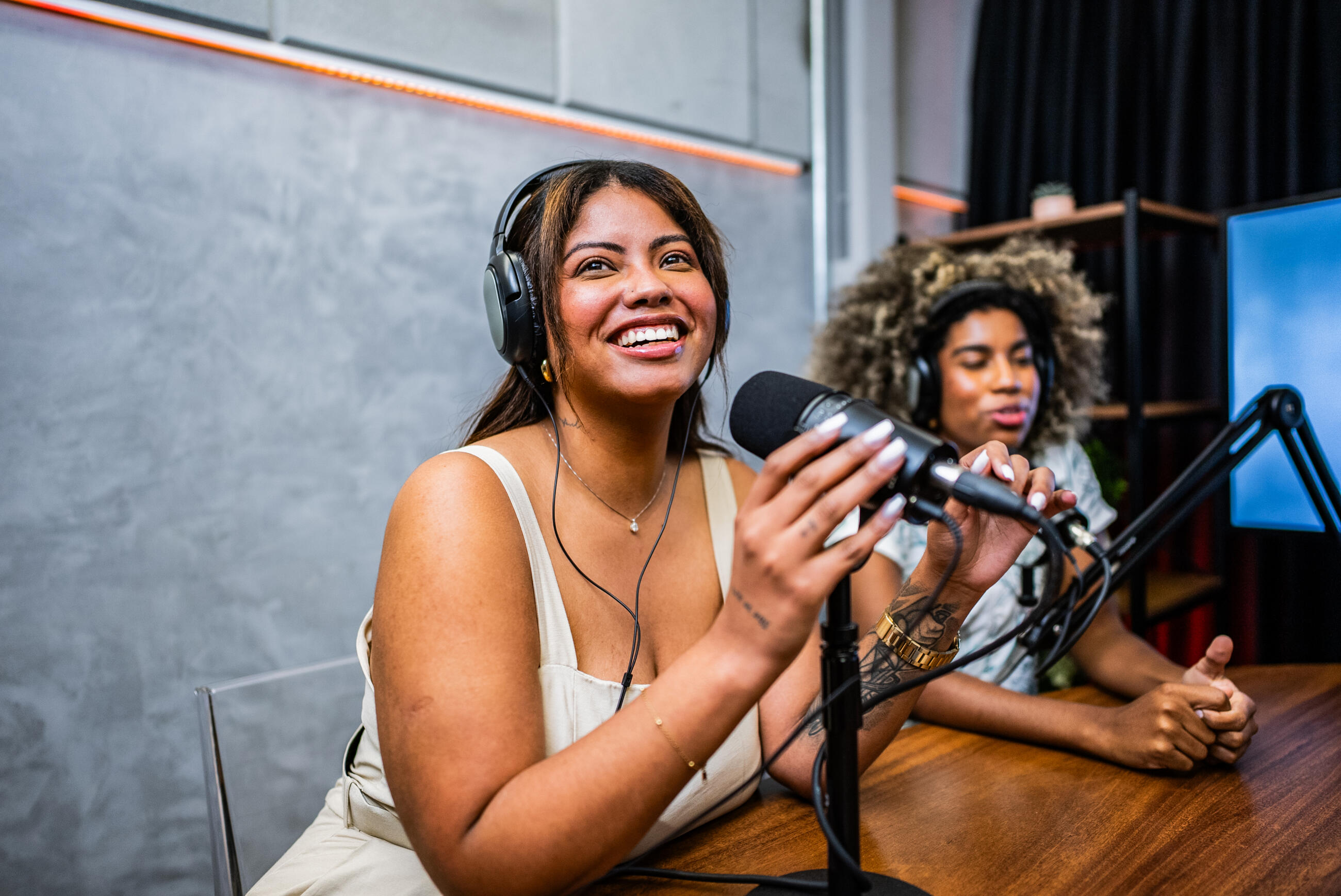 Podcast guests talking on a studio