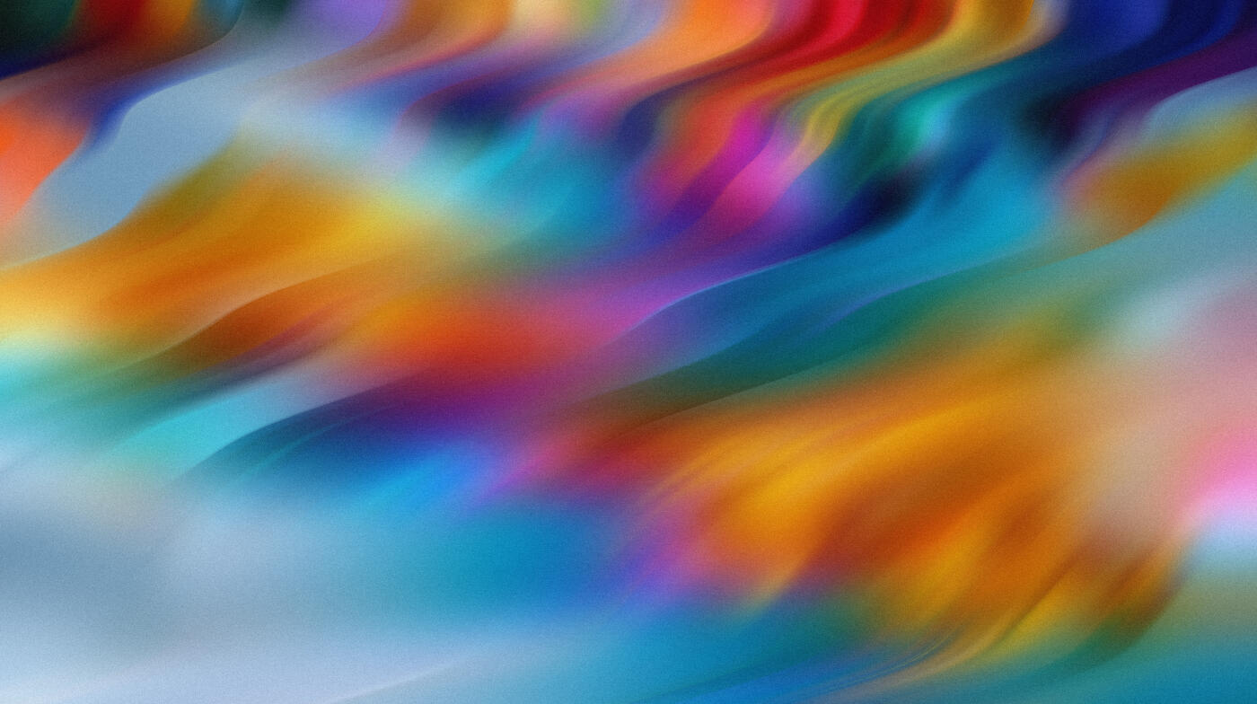 Dynamic abstract composition featuring flowing motion blur and fluid gradients in vivid blue, cyan, orange, yellow, pink, purple, and red tones. The energetic movement and soft painterly transitions create a contemporary aesthetic ideal
