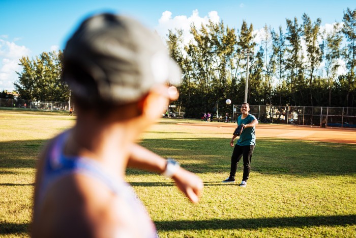Dominican guy playing baseball with his Puerto Rican girlfriend