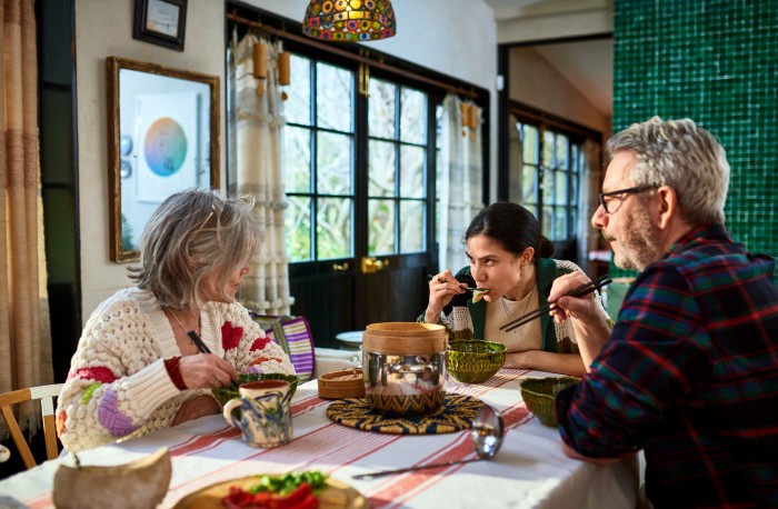 Family enjoying meal together in kitchen