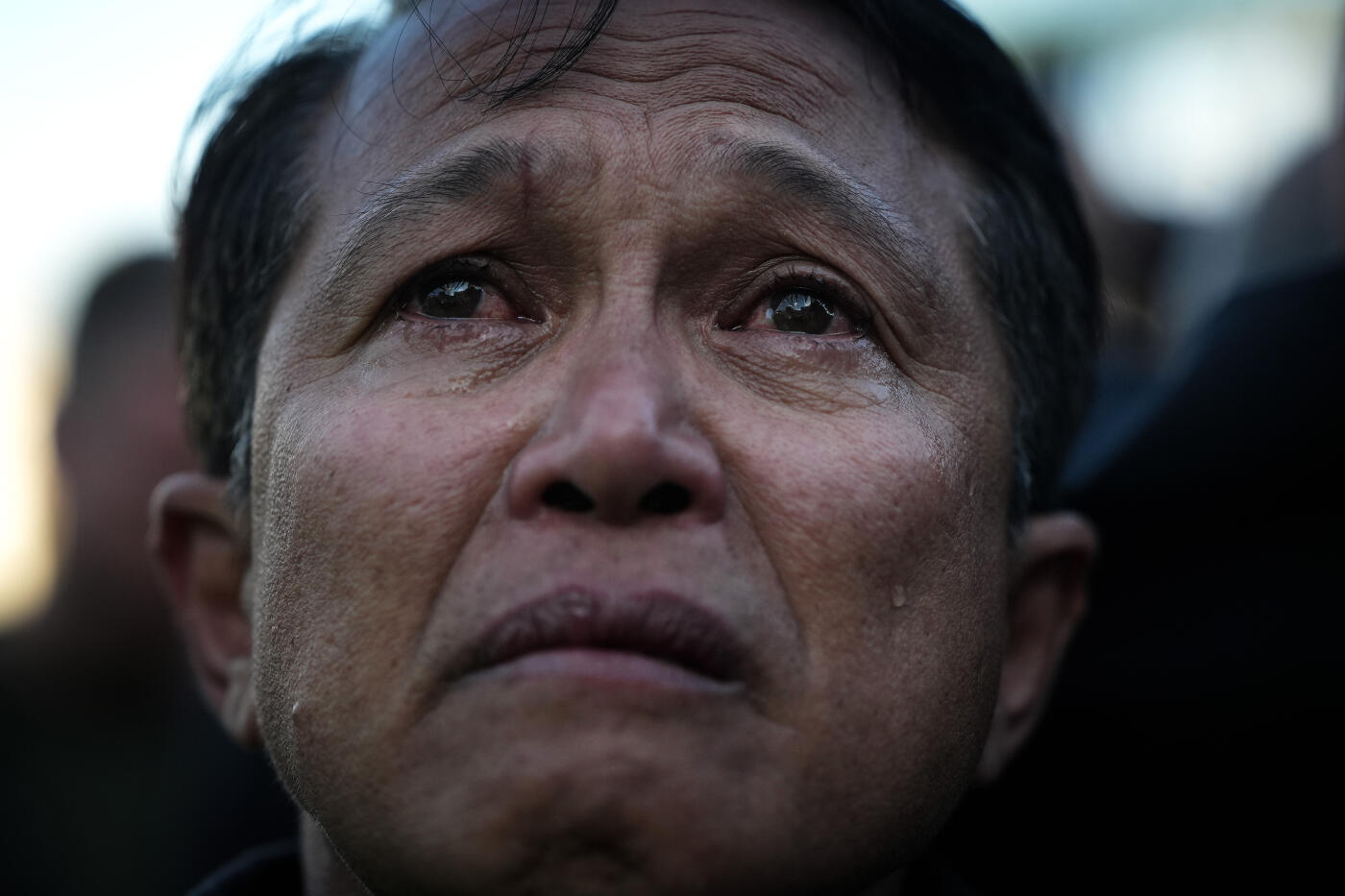 VATICAN CITY, VATICAN - MAY 08: A man cries as white smoke appears from the chimney of the Sistine Chapel declaring a new pope has been chosen on May 8, 2025 in Vatican City, Vatican. White smoke was seen over the Vatican early this evening as the Conclave of Cardinals took just two days to elect Cardinal Robert Francis Prevost, who will be known as Pope Leo (Leone) XIV, as the 267th Supreme Pontiff after the death of Pope Francis on Easter Monday. (Photo by Christopher Furlong/Getty Images)