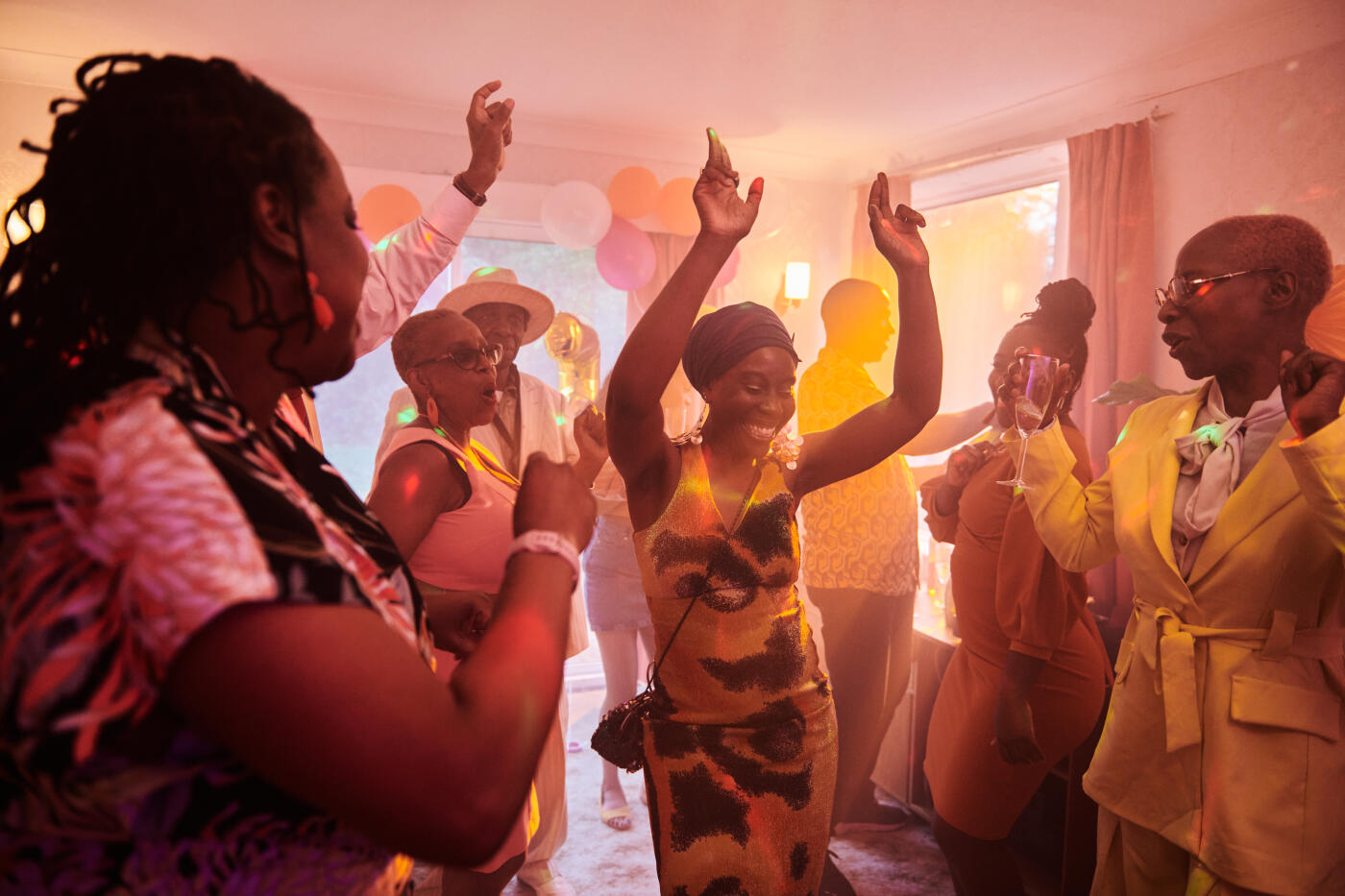 A celebration at home with people relaxing, having fun and enjoying themselves.