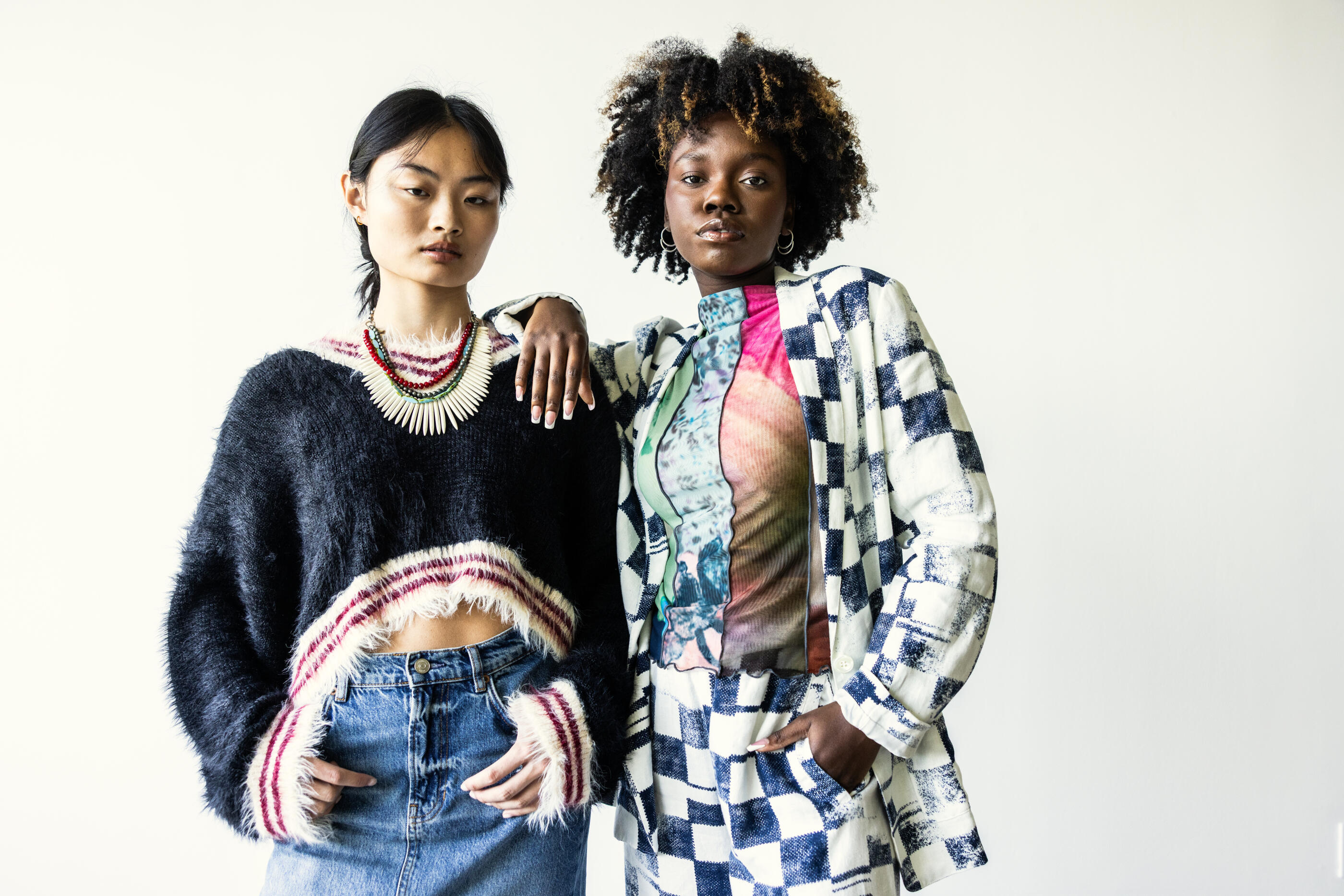 Portrait of fashionable young women on white background