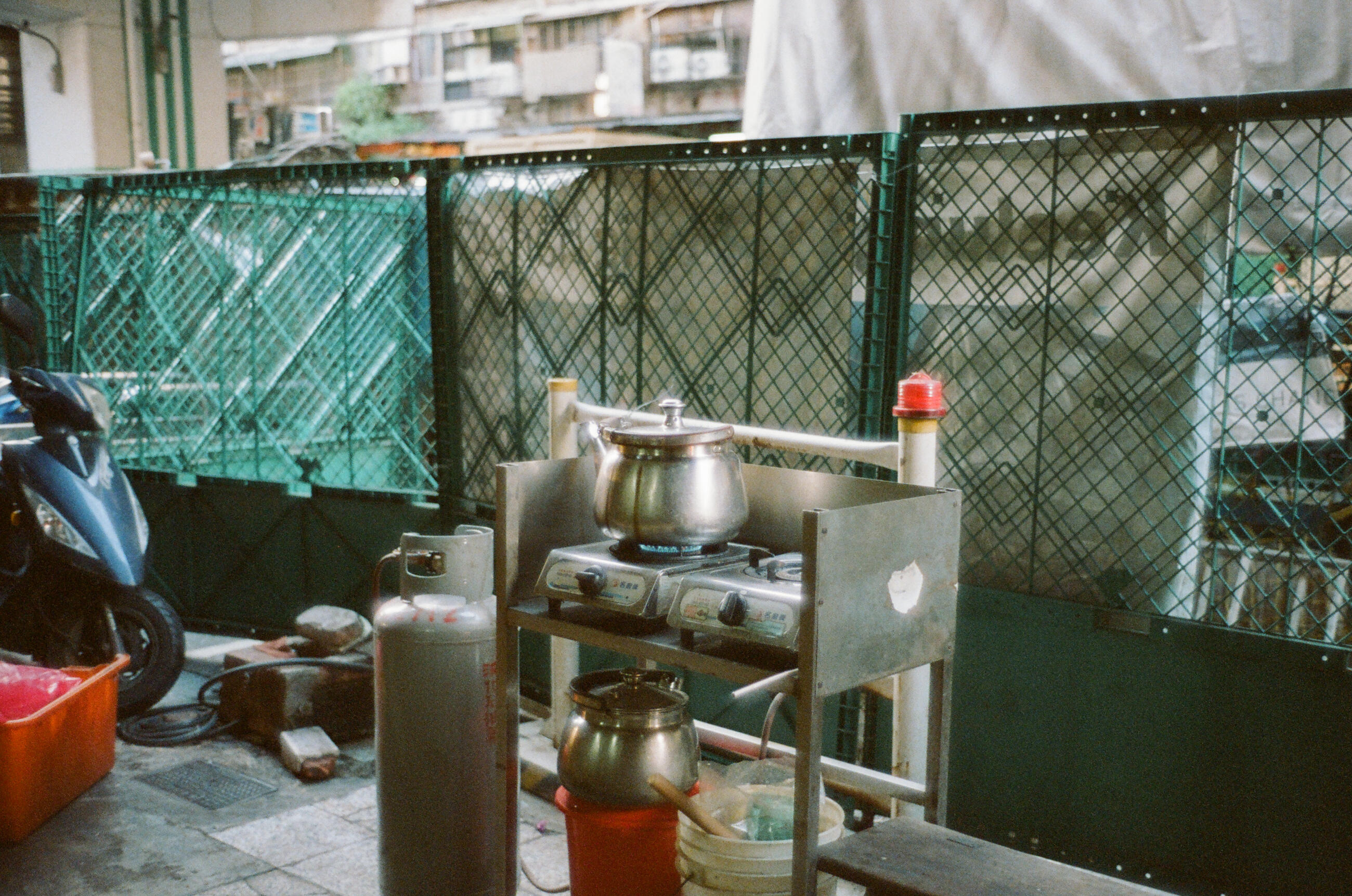 Herbal Medicine Store Boil Some Water In the Stovetop Kettle On The Storefront Overhangs Near Mesh Fence in Keelung City
