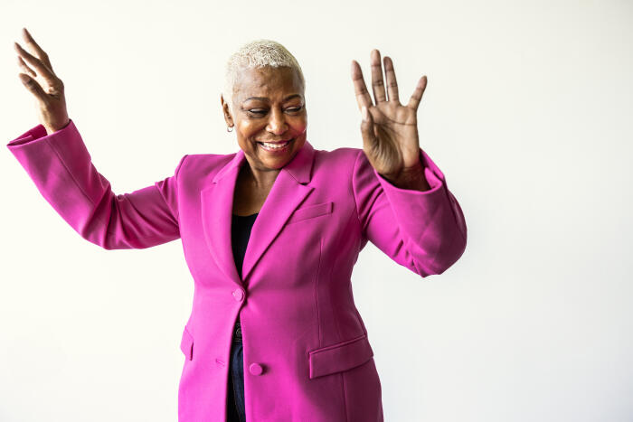 Portrait of beautiful senior woman with short hair on white background