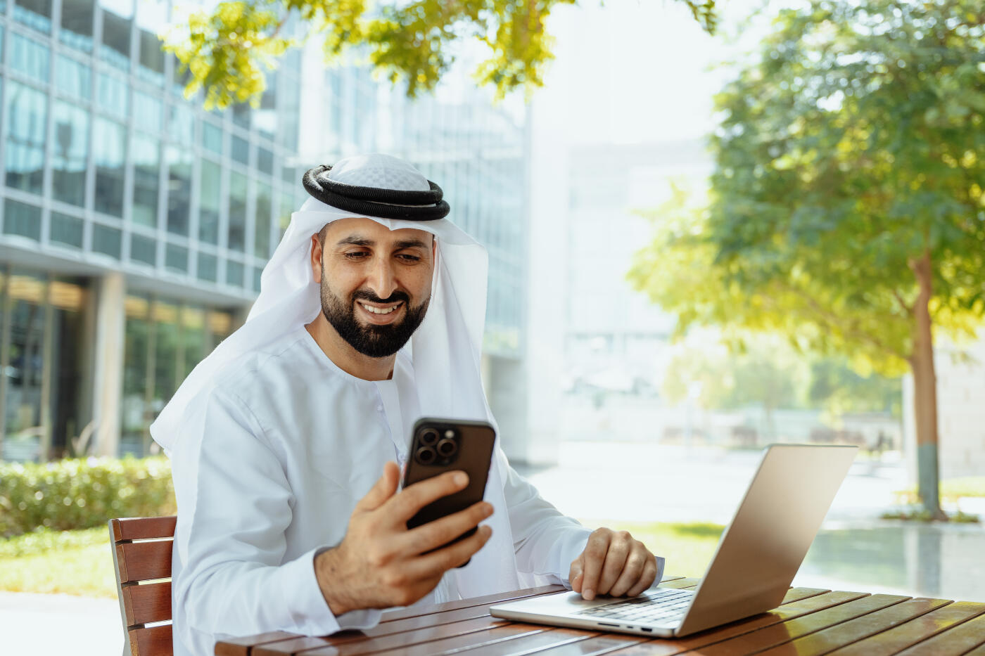 Portrait of Arab Businessman in thawb in business district