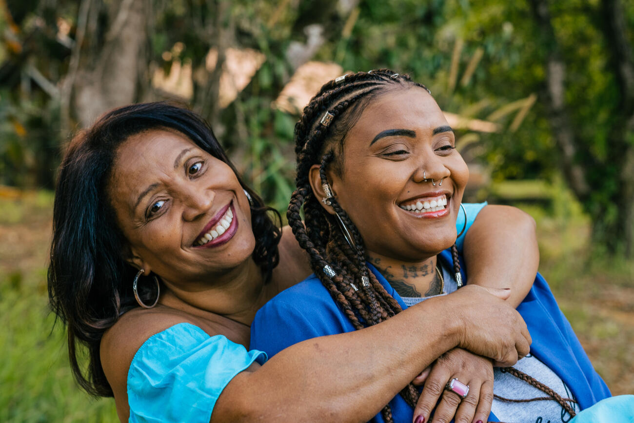 Mother hugging adult daughter