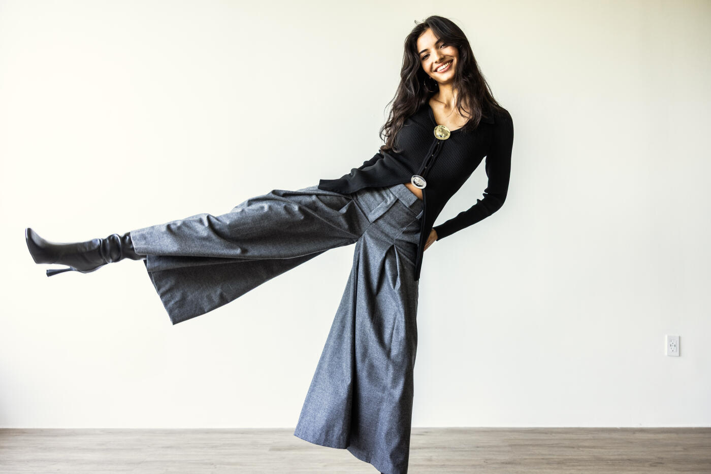 Portrait of beautiful and fashionable young woman on white background