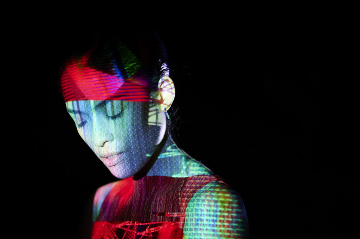 Woman with abstract shapes across her face