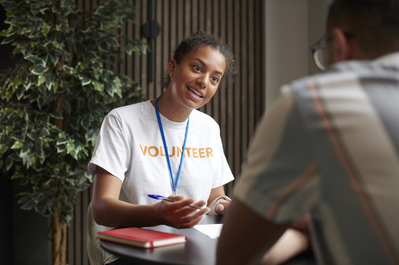 volunteer helping with claim forms