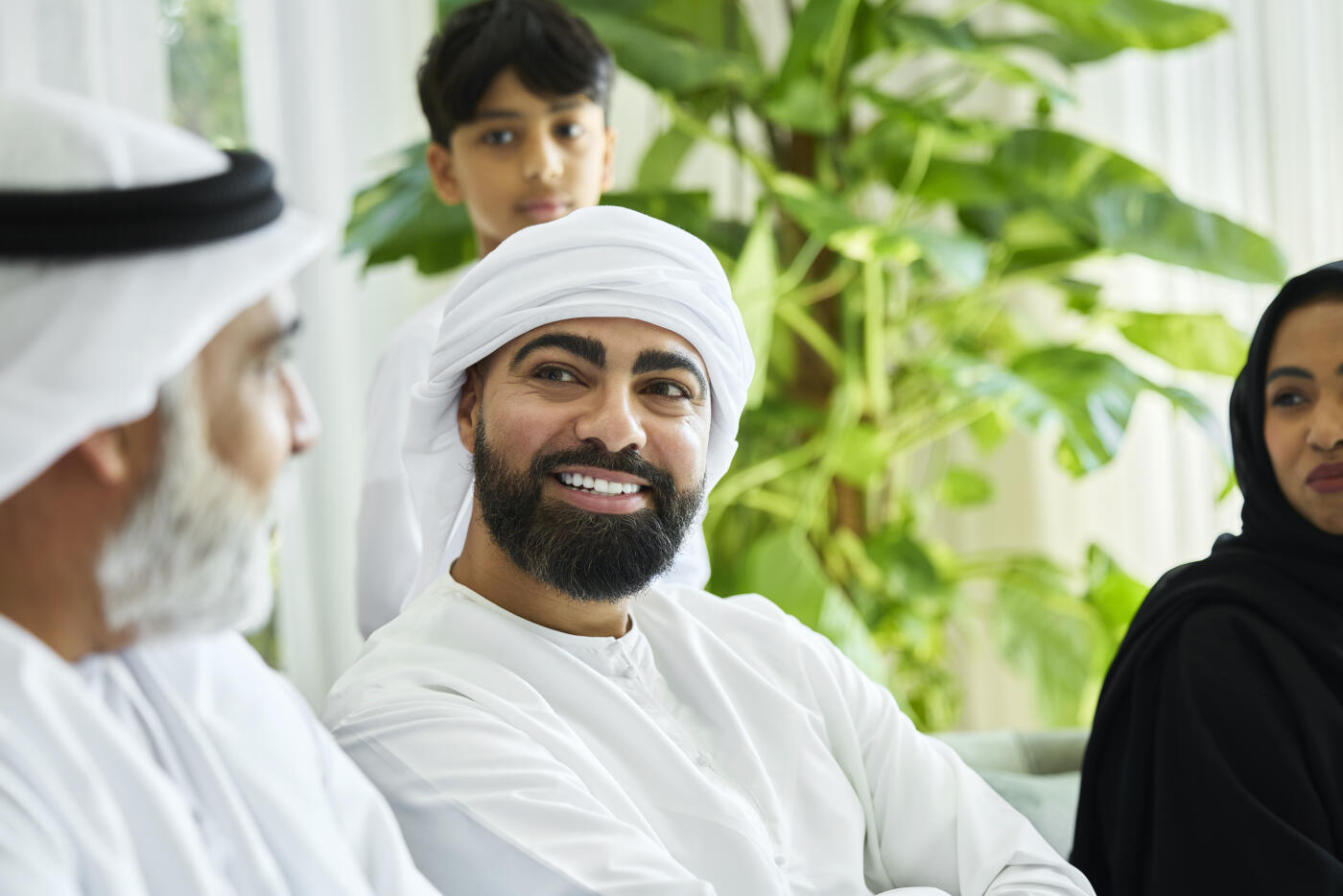 Arab male having conversation with his father