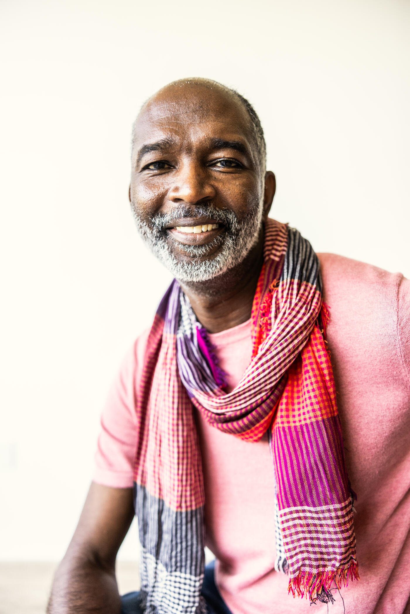 Portrait of fashionable senior man with gray hair on white background